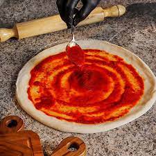 عکس, ترفند ریختن سس کچاپ روی خمیر پیتزا قبل از مواد